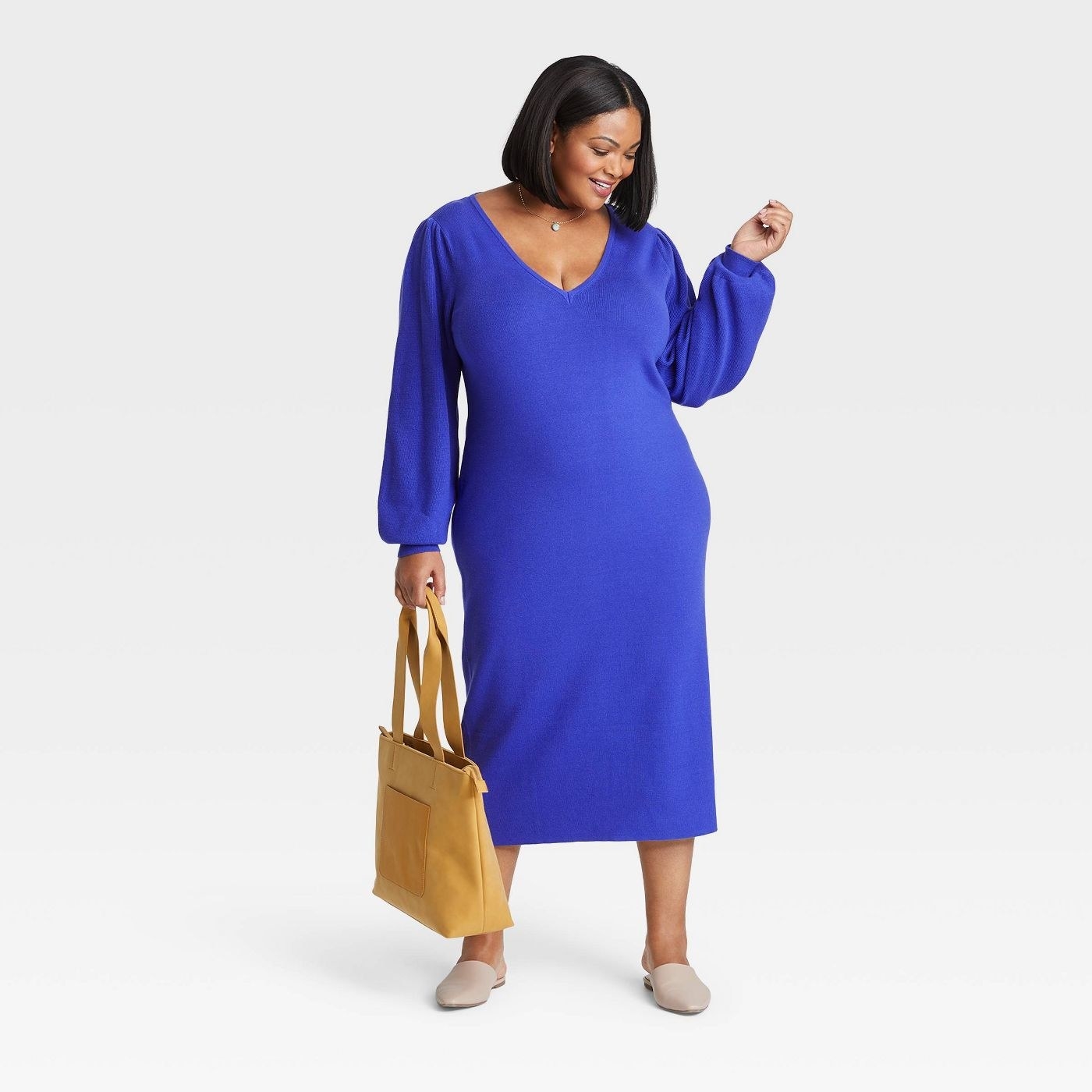 model in royal blue sweater midi dress with balloon sleeves