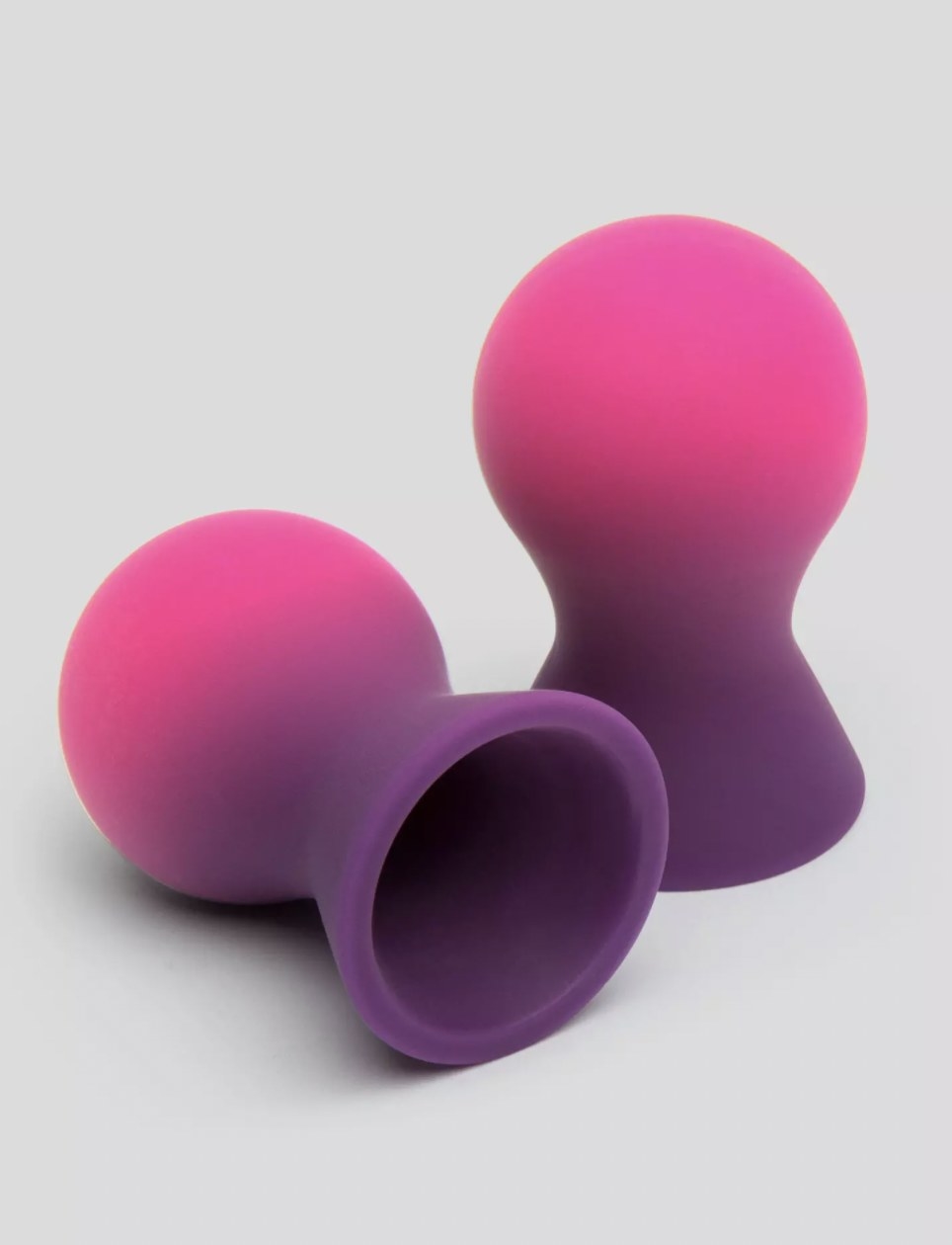 The purple and pink silicone nipple suckers with spherical shape