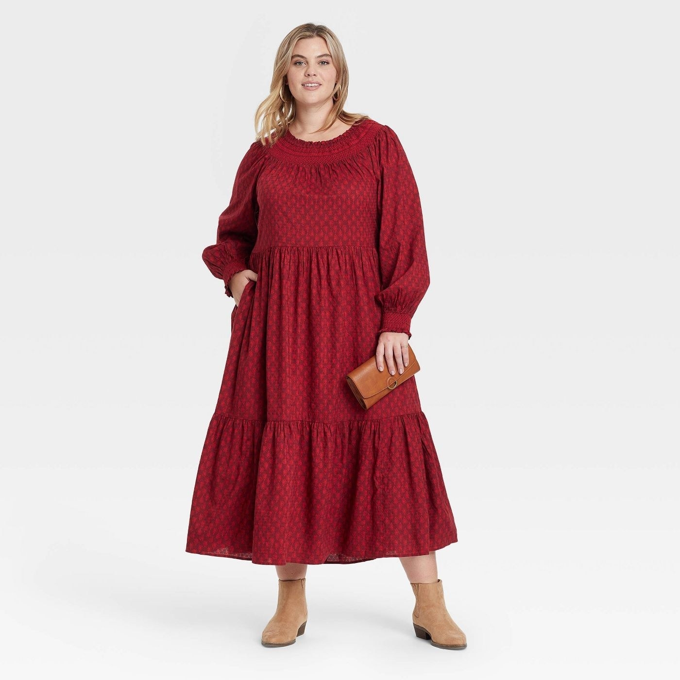 model in red monochromatically patterned tiered maxi dress