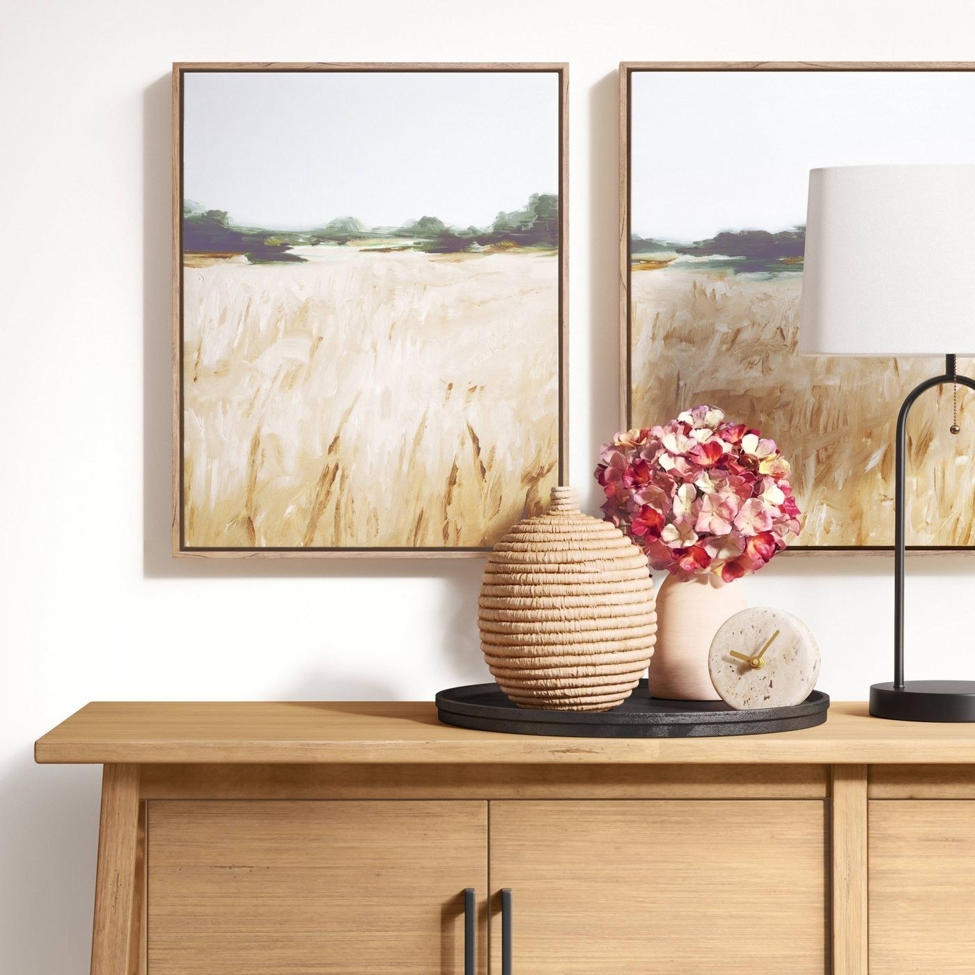pair of canvases over a credenza