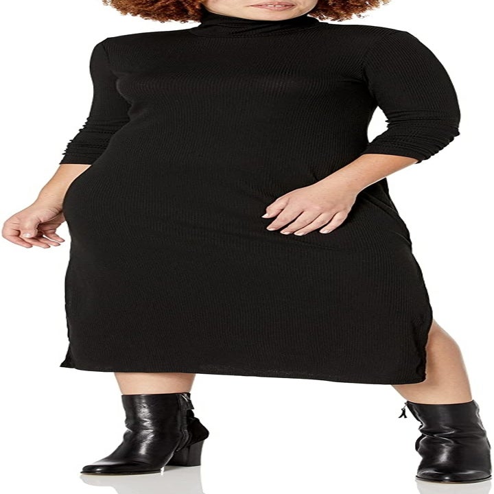 another model wearing the solid black dress