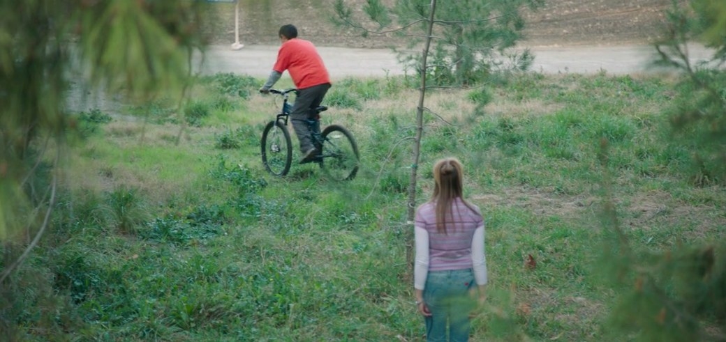 Anna watches as Steve rides away on his bike