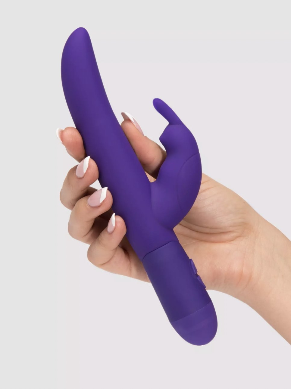 The purple rabbit vibe held in someone&#x27;s hand