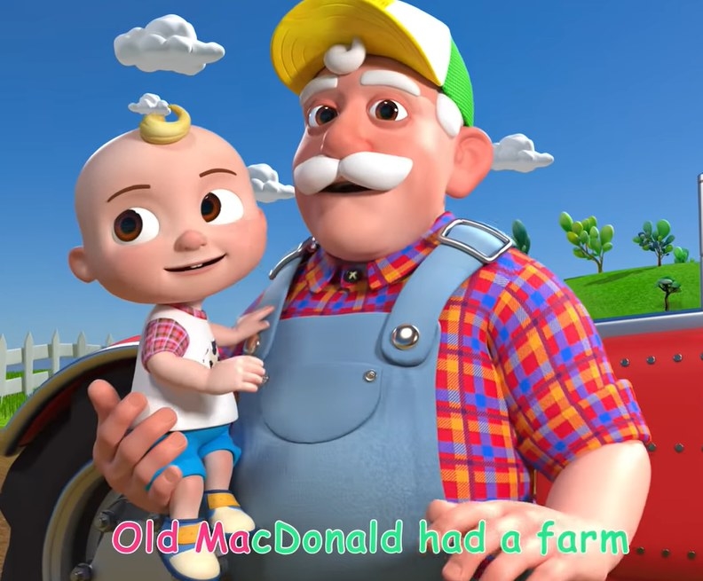 Old Macdonald holding JJ on his arm about to walk onto his farm