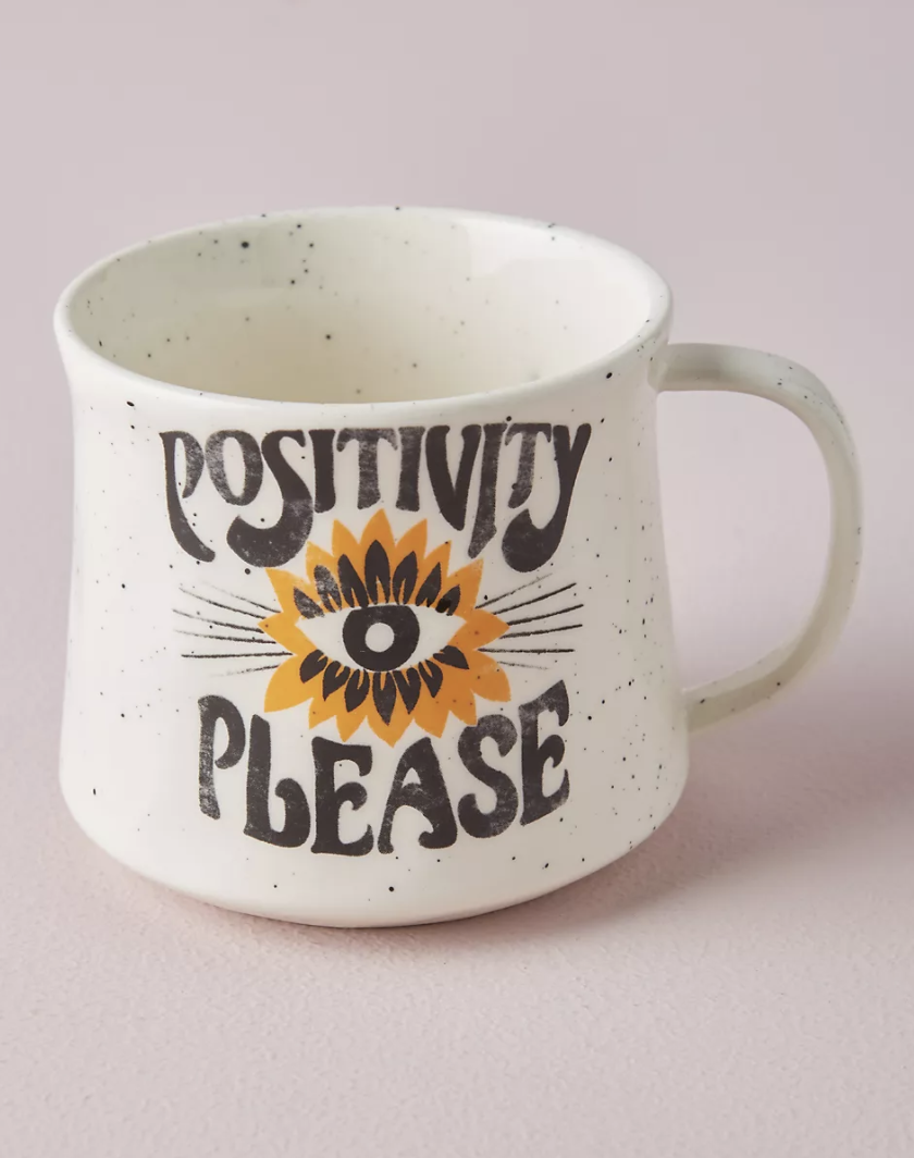 a speckled mug that says positive please on it