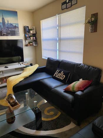 Reviewer photo of the black faux leather sectional sofa