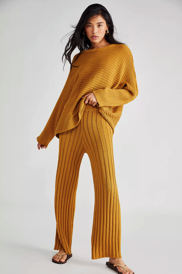 A different model wears the cropped cardigan in yellow