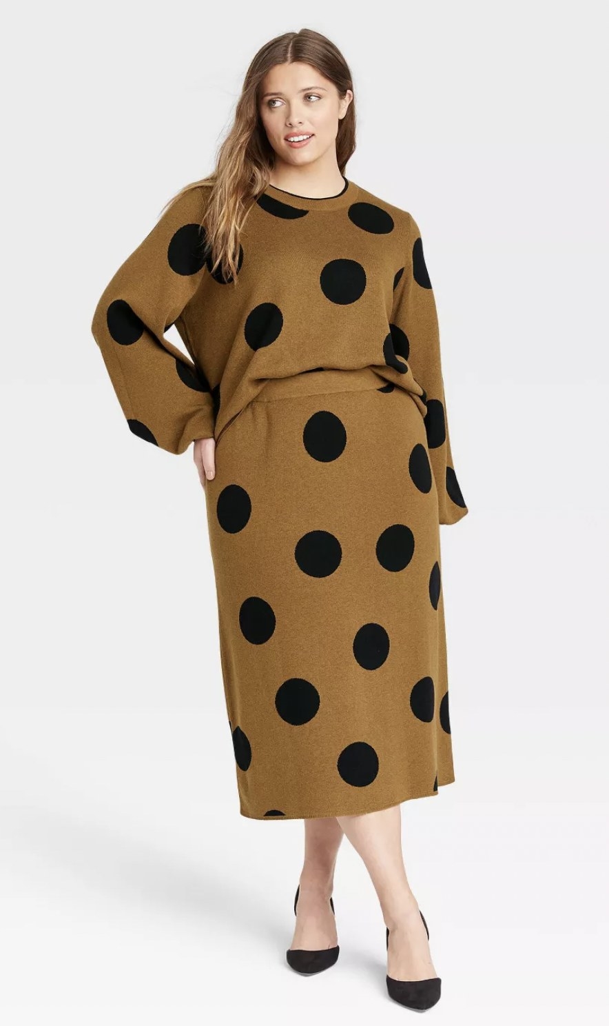 the skirt in a brown color with large black polka dots