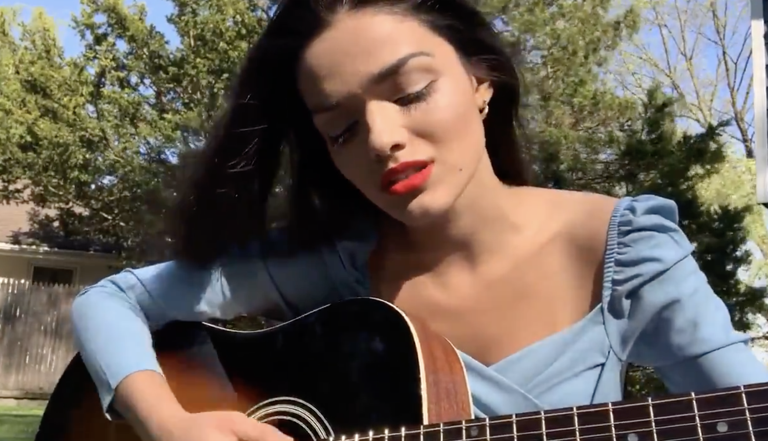 Rachel playing guitar