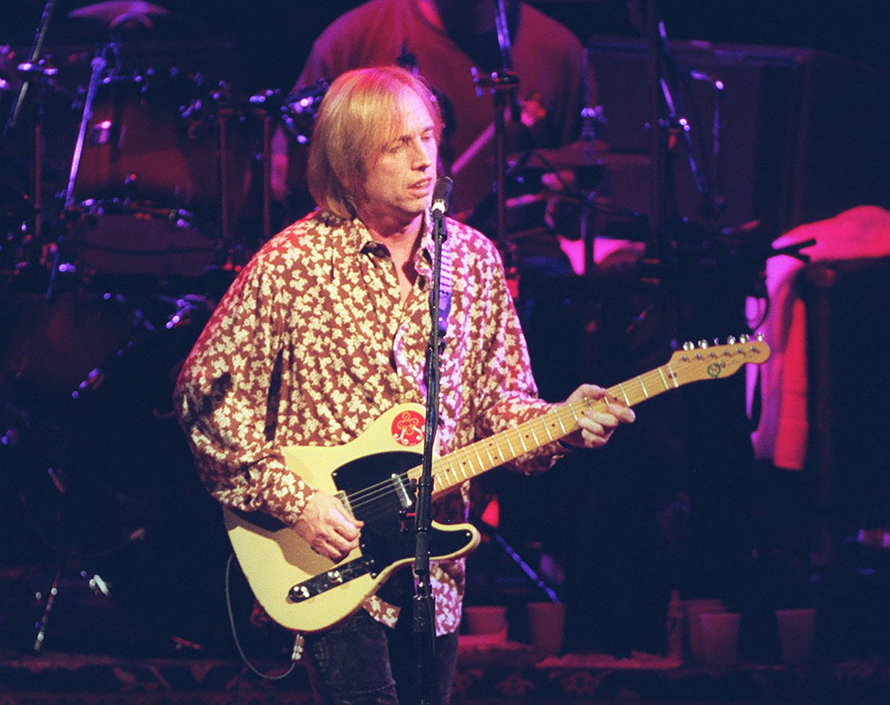 Tom Petty performing in a concert