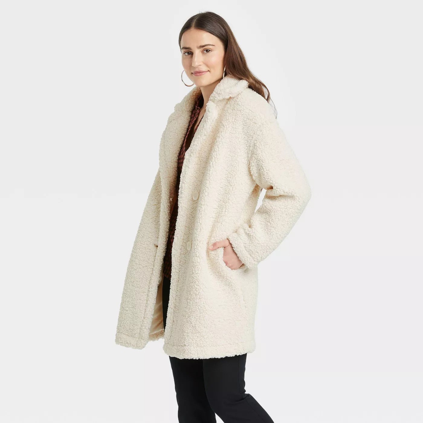 model wearing the coat in cream
