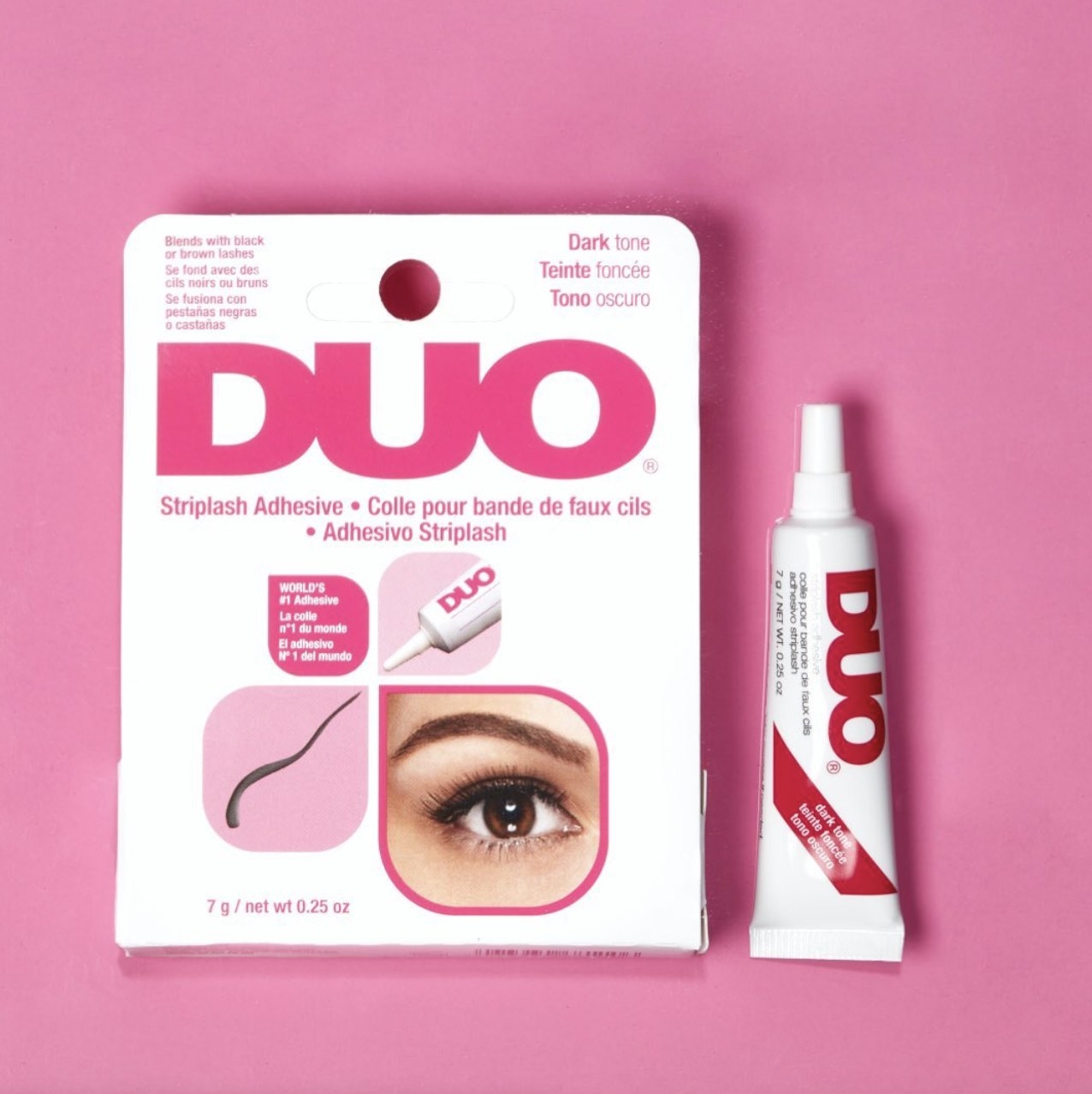 A package of strip lash adhesive and a tube of eyelash glue