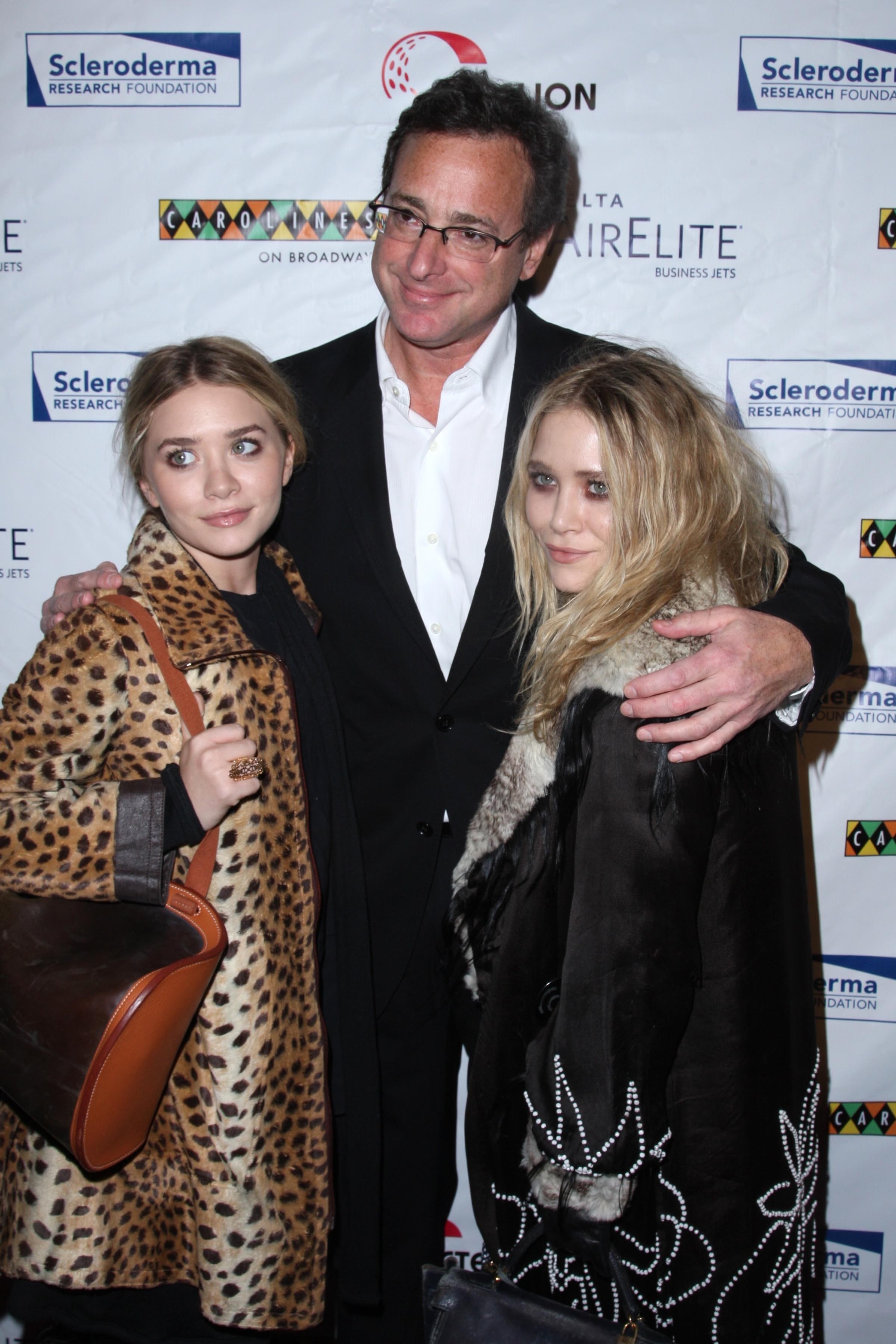 Mary-Kate Olsen, Bob Saget, and Ashley Olsen attend the Cool Comedy Gala in 2009
