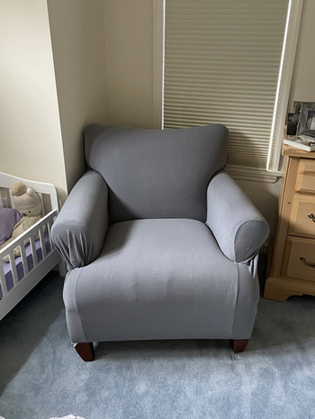 the same chair covered in a solid gray slipcover
