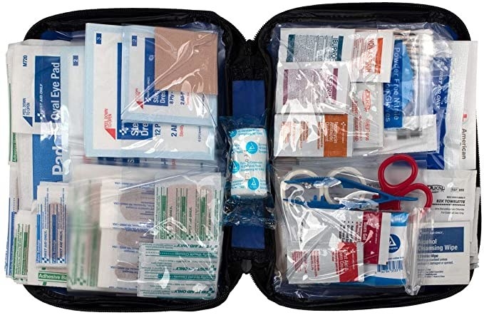 Open first aid kit full of medical supplies