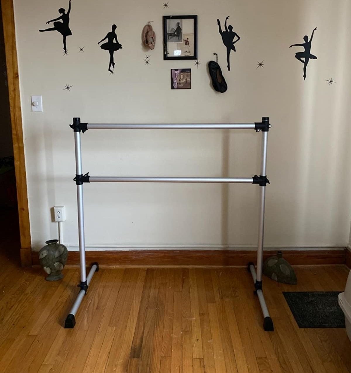 Reviewer photo of a free standing ballet barre in a living room