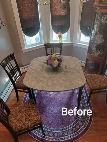 dining table with brown wood back chairs and brown seat cushions