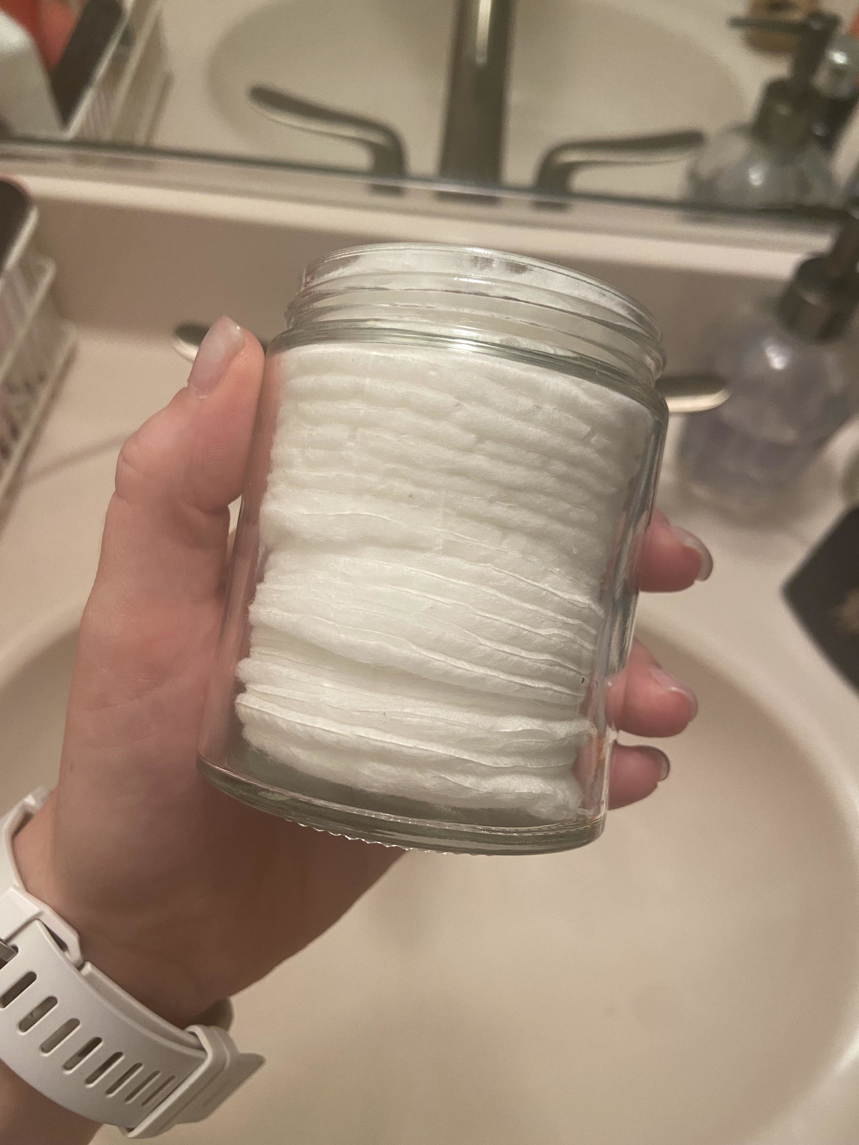 A jar of cotton rounds.