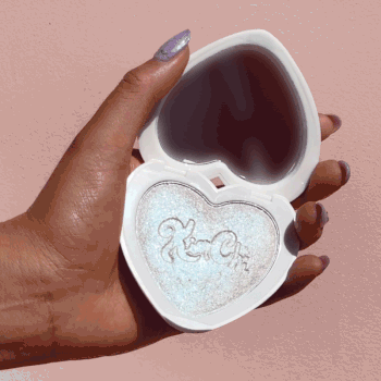 gif of person holding heart-shaped kim chi highlighter compact