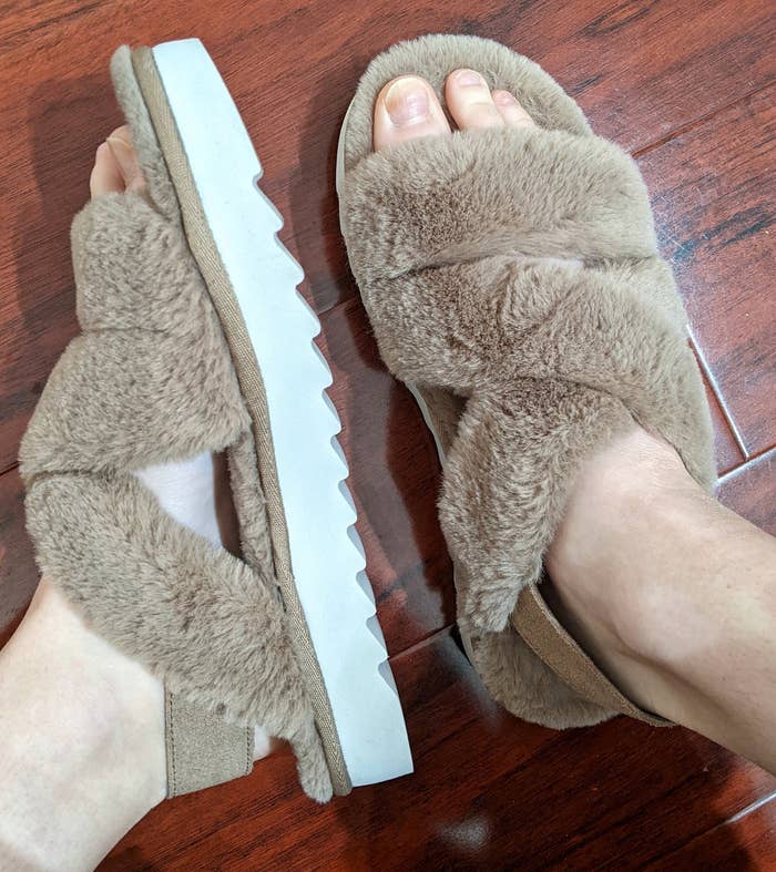 a reviewer wearing the furry slingback sandals in tan