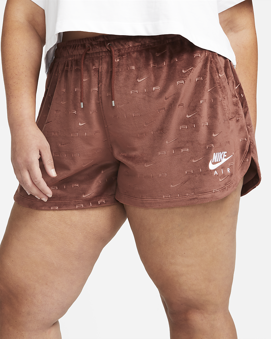 Model is wearing brown mid rise shorts