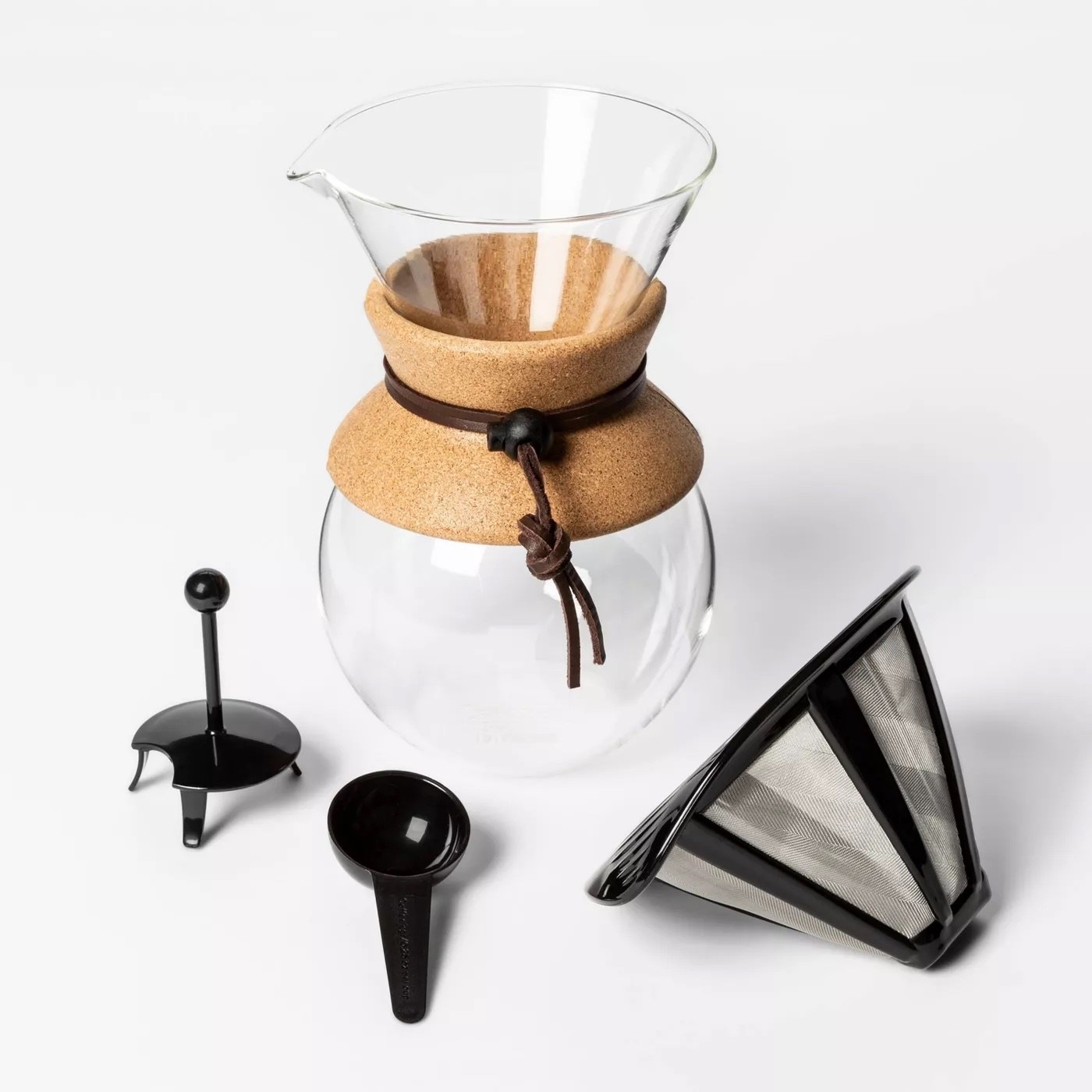A pour over coffee maker with all black accessories