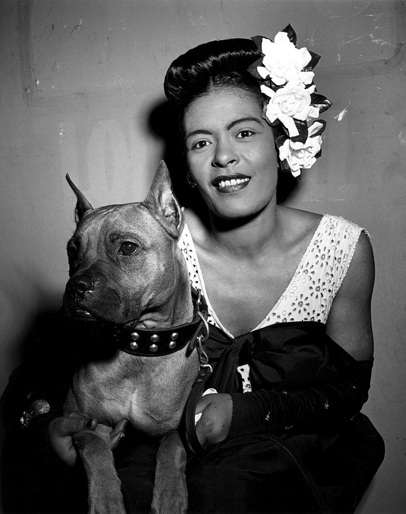 Holiday posing with a dog in the 1940s