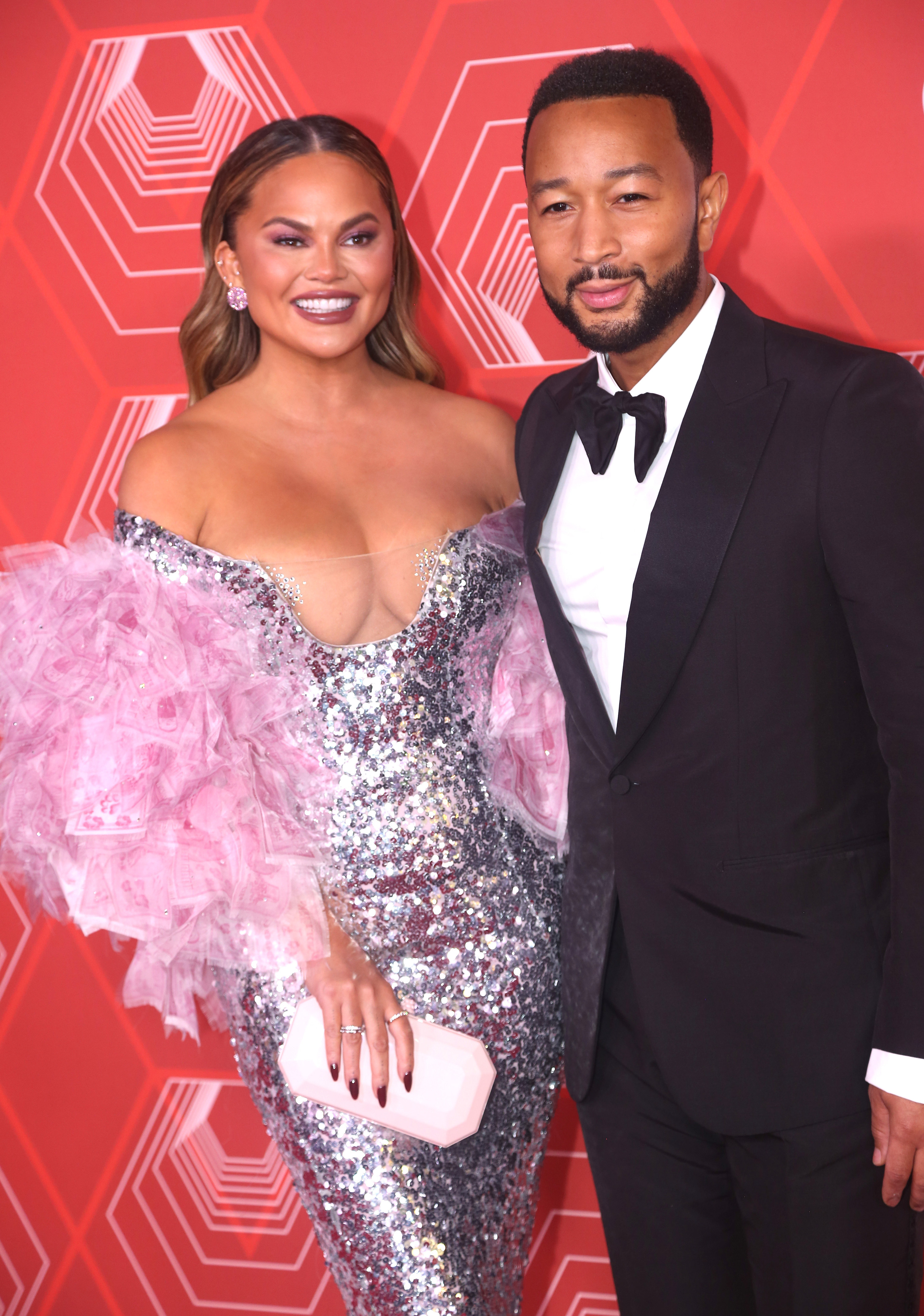 Chrissy Teigen and John Legend pose at the 74th Annual Tony Awards on September 26, 2021