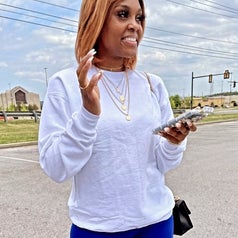 reviewer wearing the white crewneck