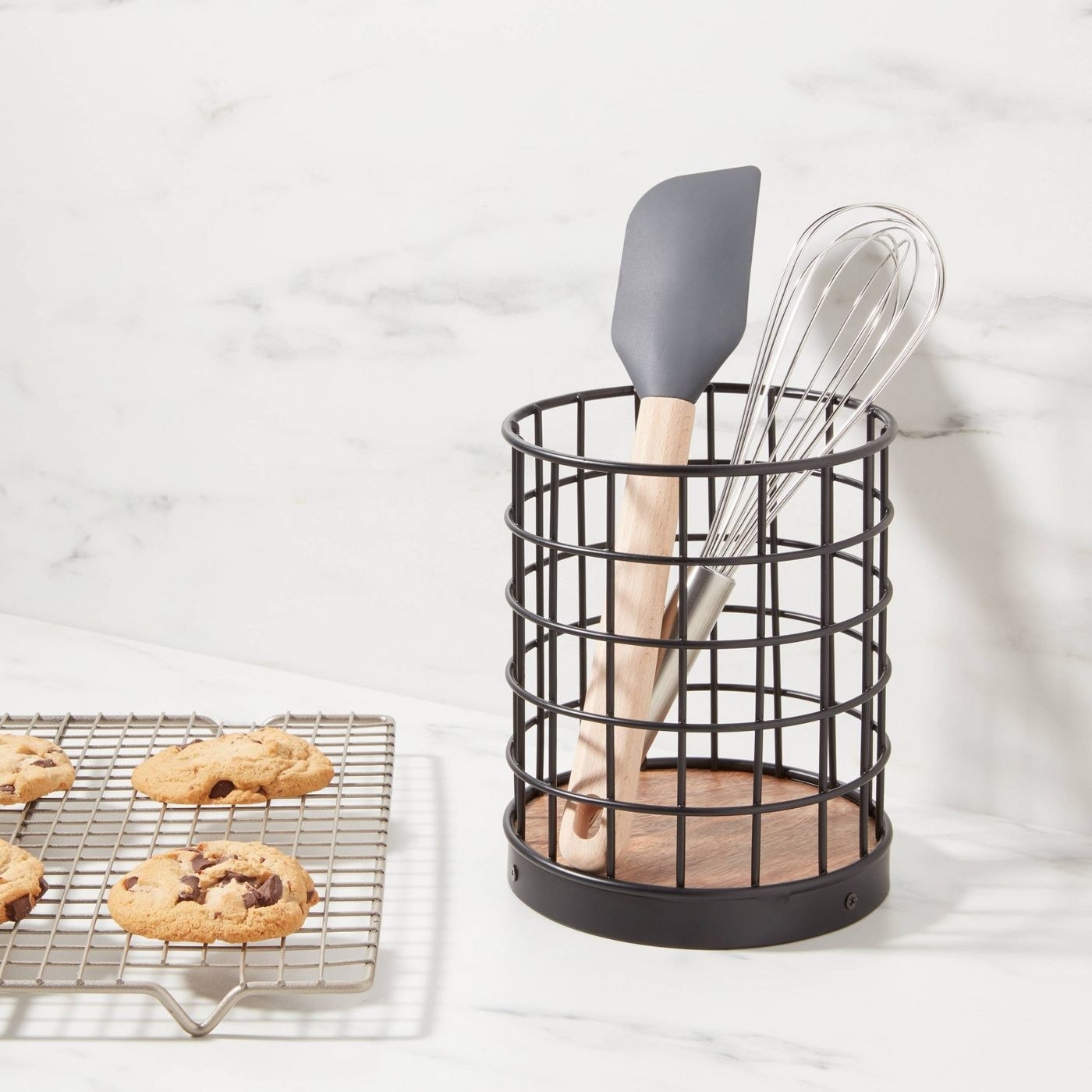 The utensil holder with a whisk and spatula