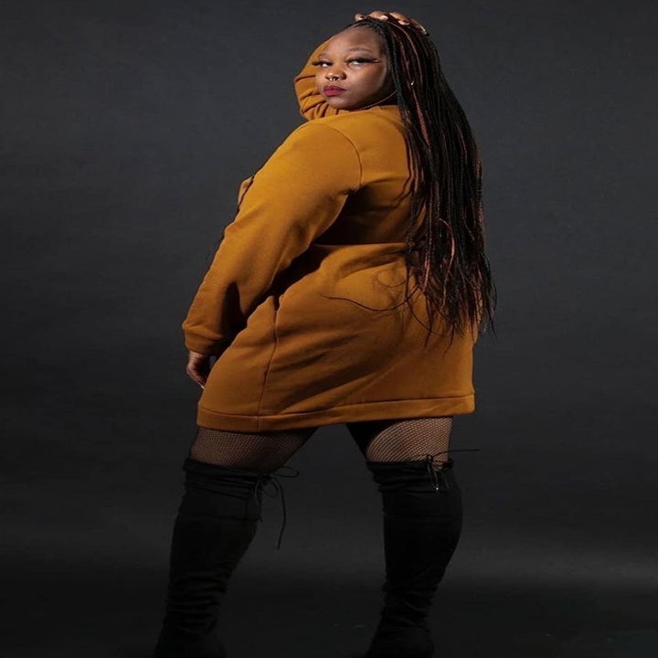 back of reviewer wearing the yellow sweatshirt dress