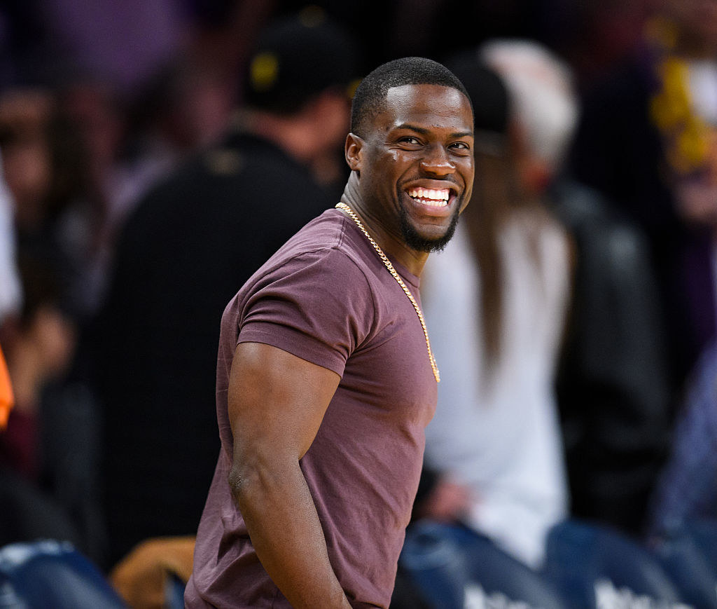 Kevin Hart smiling at a basketball game