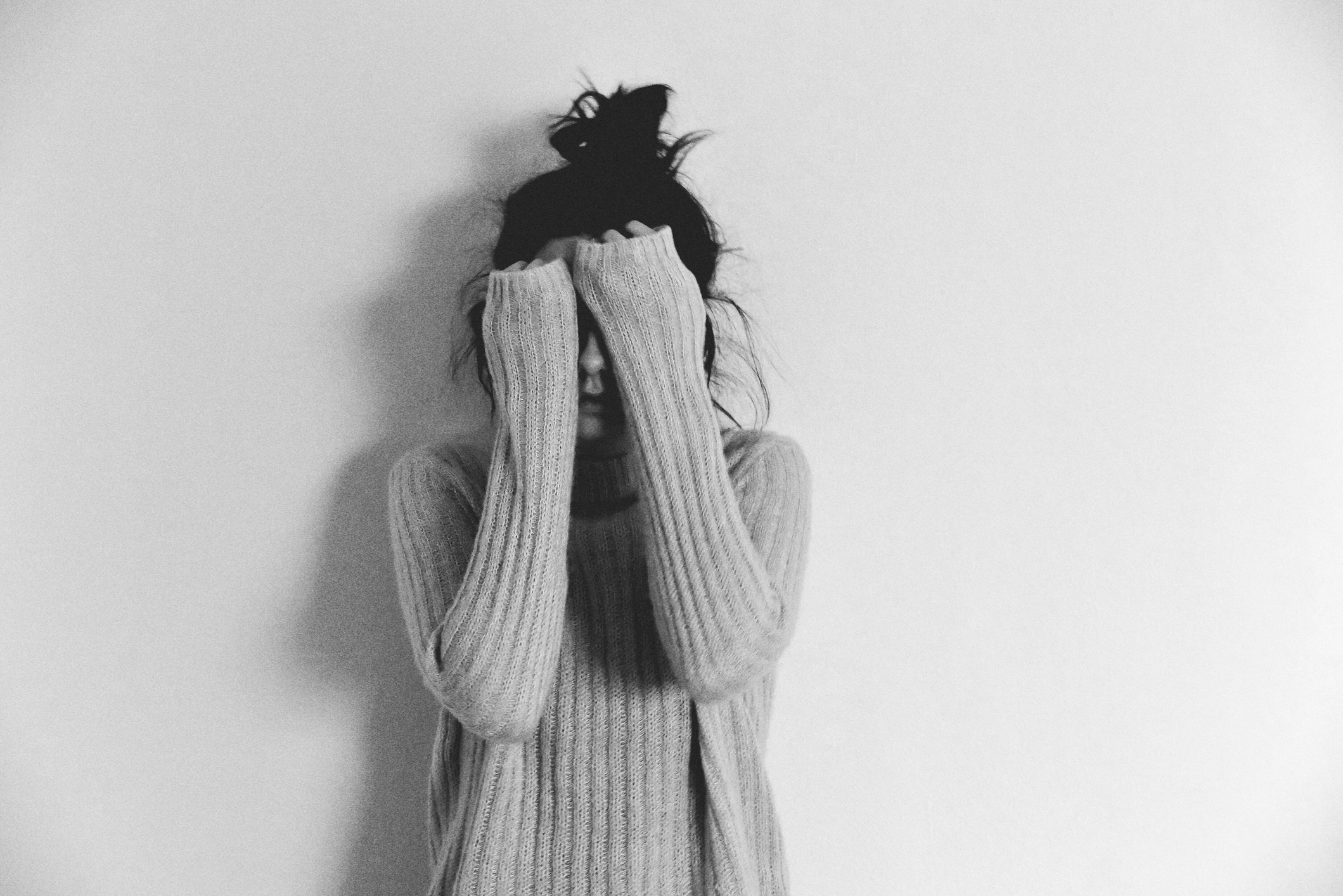 girl covering her face with her hands