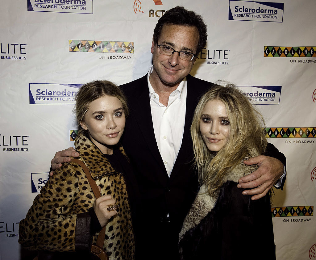 Bob on the red carpet posing for a photo with the Olsen twins