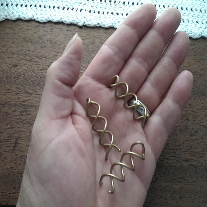 A customer review photo of them holding the hair pins in the palm of their hands