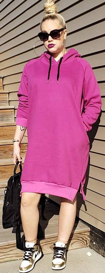 reviewer wearing the pink hoodie dress