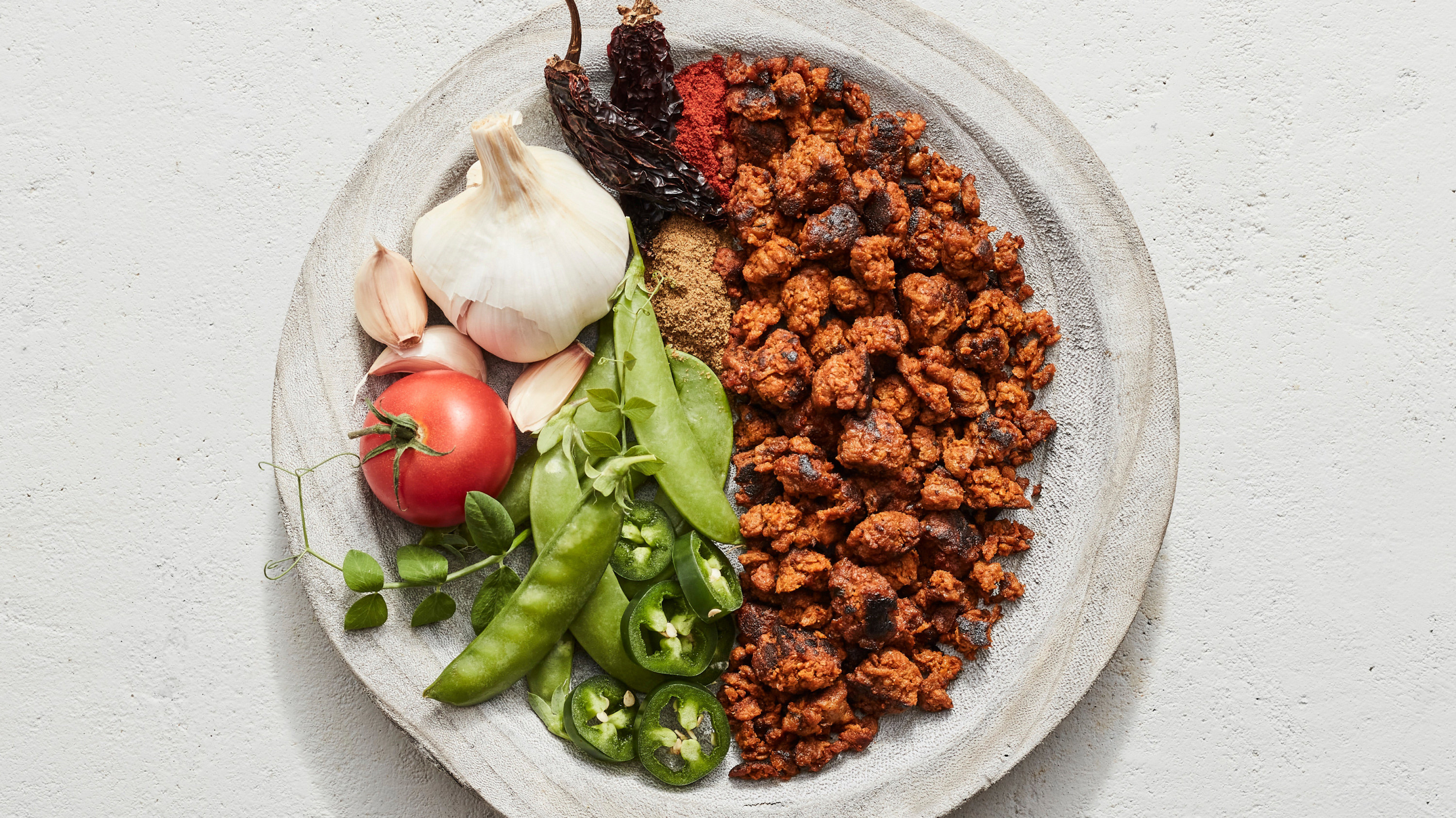 a bowl with plant-based chorizo and vegetables