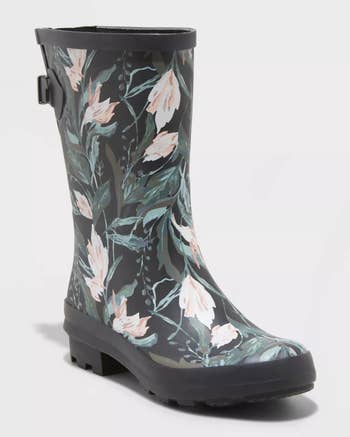 a mid-calf pink, green, and gray floral rubber boot