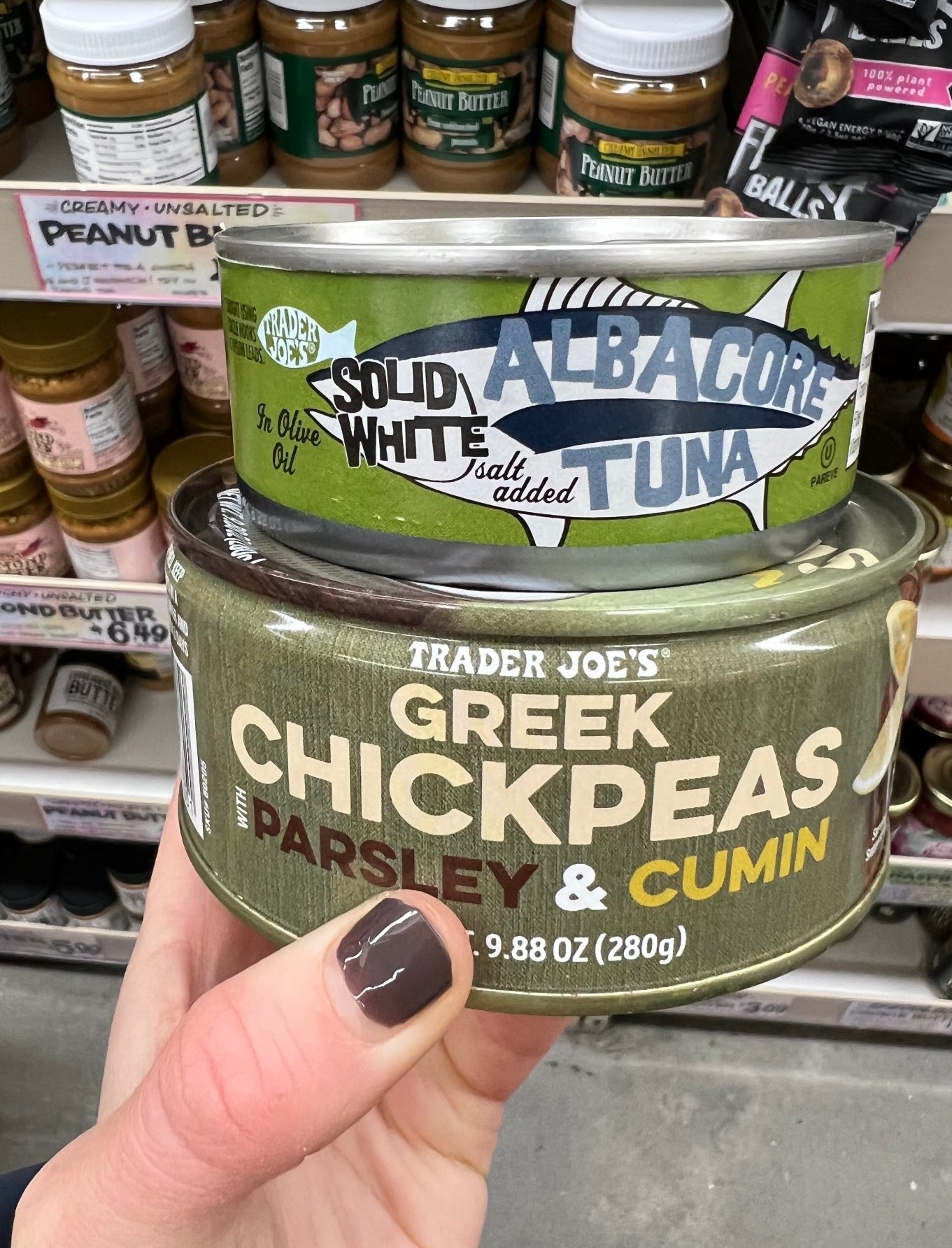 A can of tuna fish and a can of chickpeas.