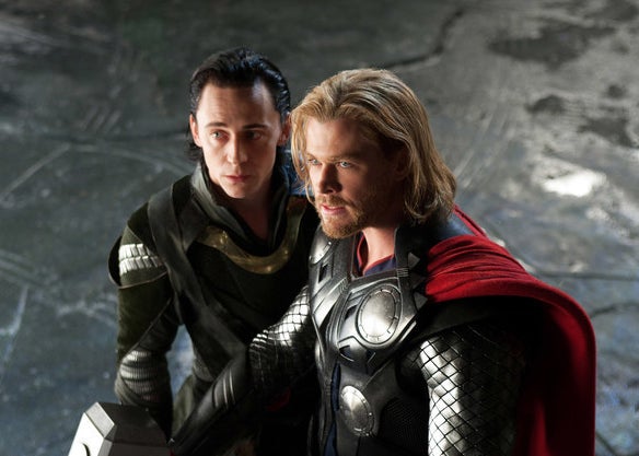 Loki and Thor standing beside each other