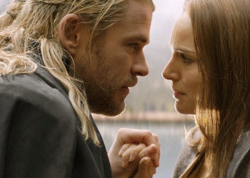 Thor and Jane holding hands and looking at each other