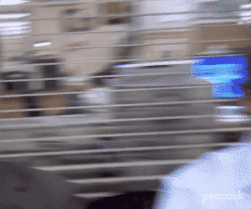 Rainn Wilson as Dwight Schrute glares into the camera as he rolls his eyes and looks away in