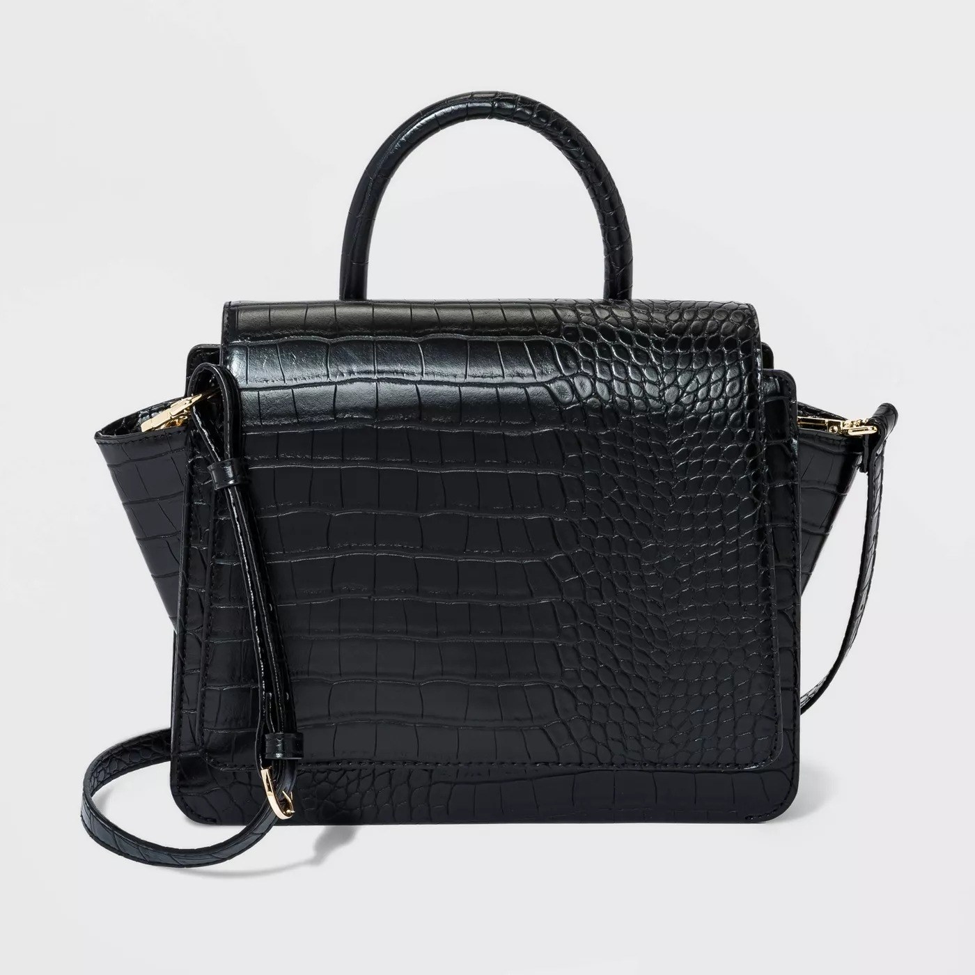 The black bag with  texture and top handle
