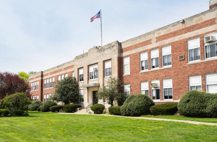 Exterior view of a typical American school building seen on a spring day