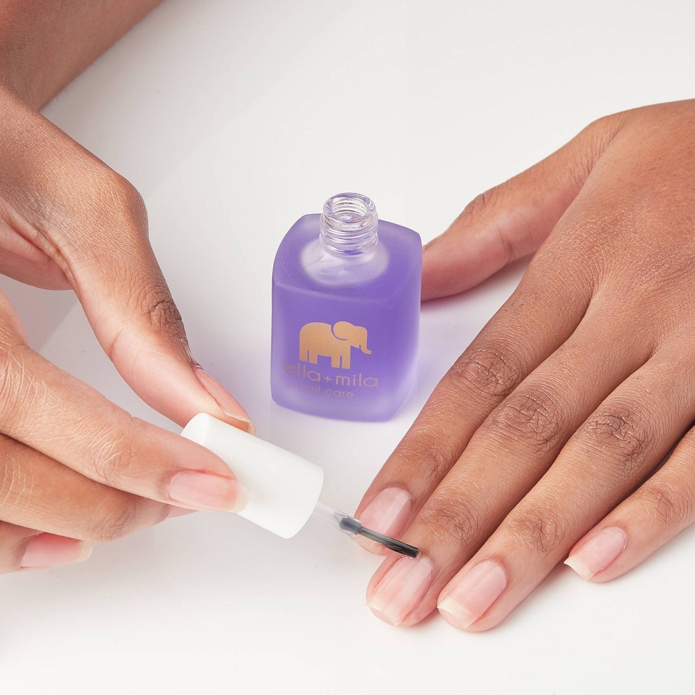 Model using the nail care cuticle oil