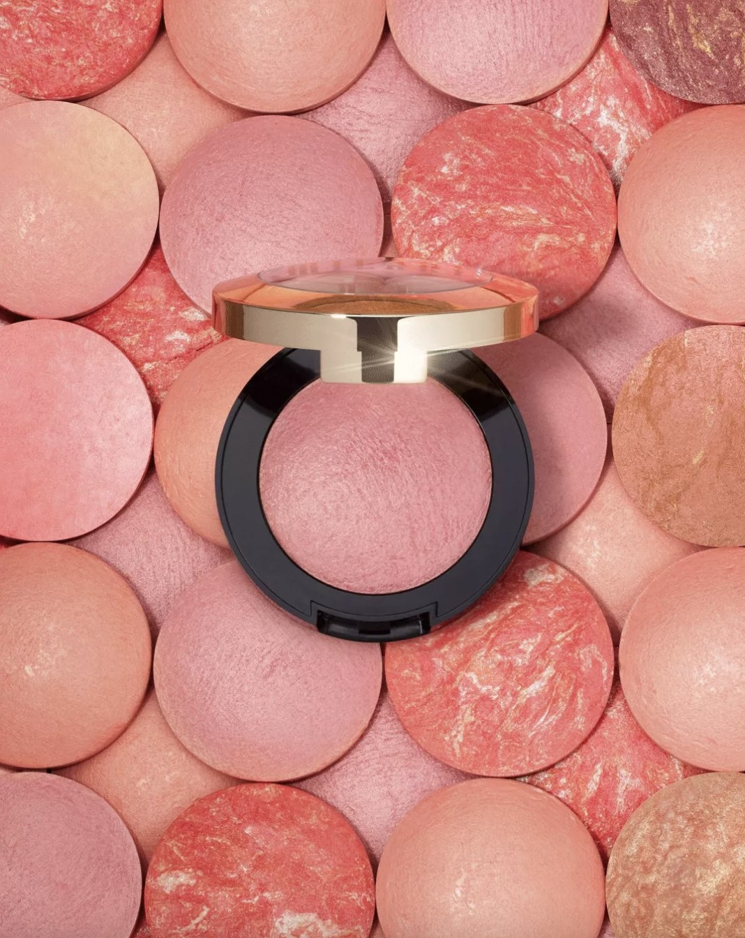 A blush compact placed on a various blush colors