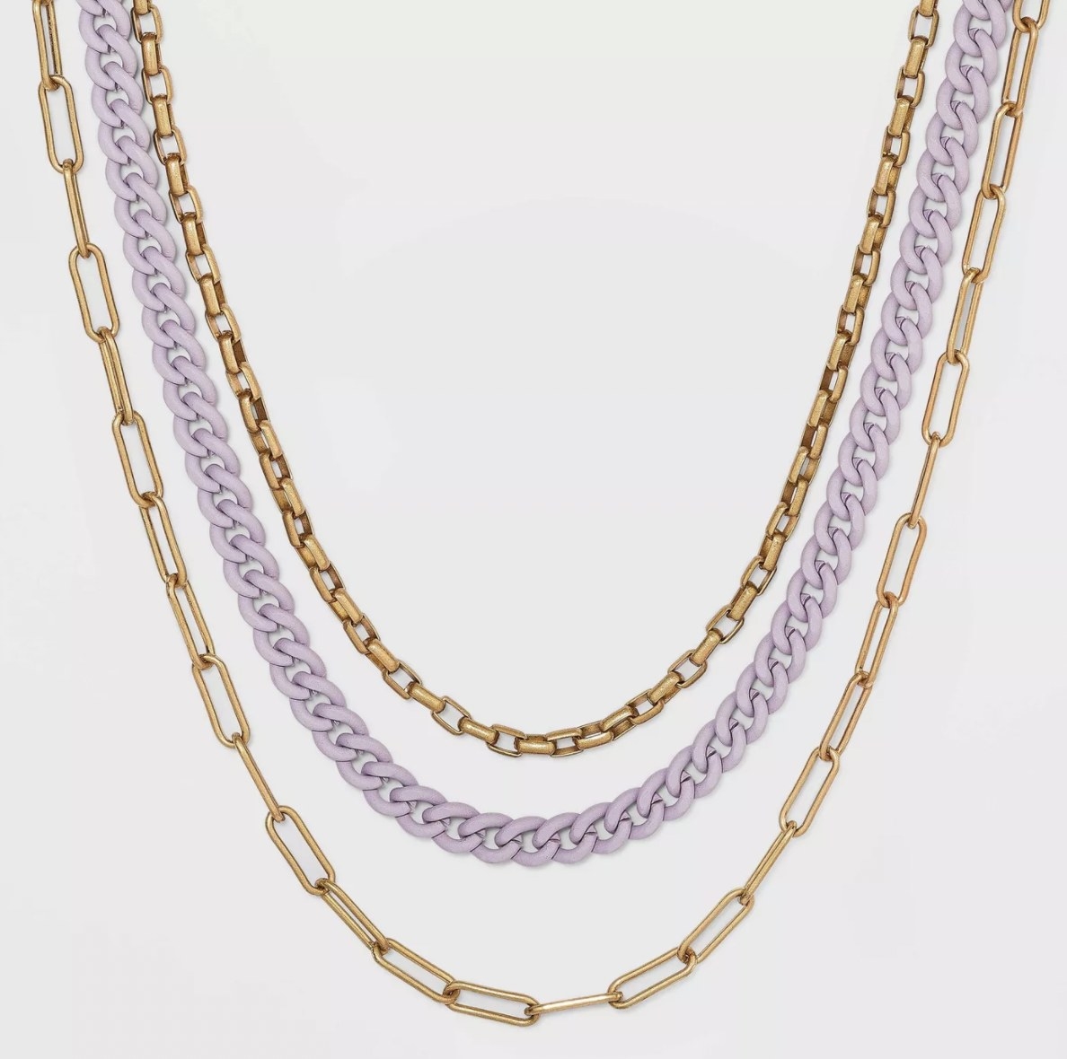 the necklace with two gold chains and one purple chain