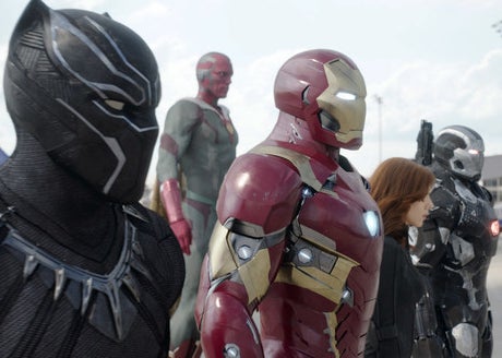 Black Panther, Iron Man, Vision, Black Widow, and War Machine standing beside each other 