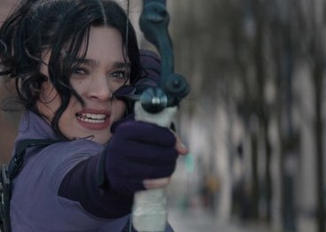 Kate Bishop holding up her bow and arrow