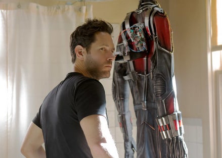 Scott standing beside his suit